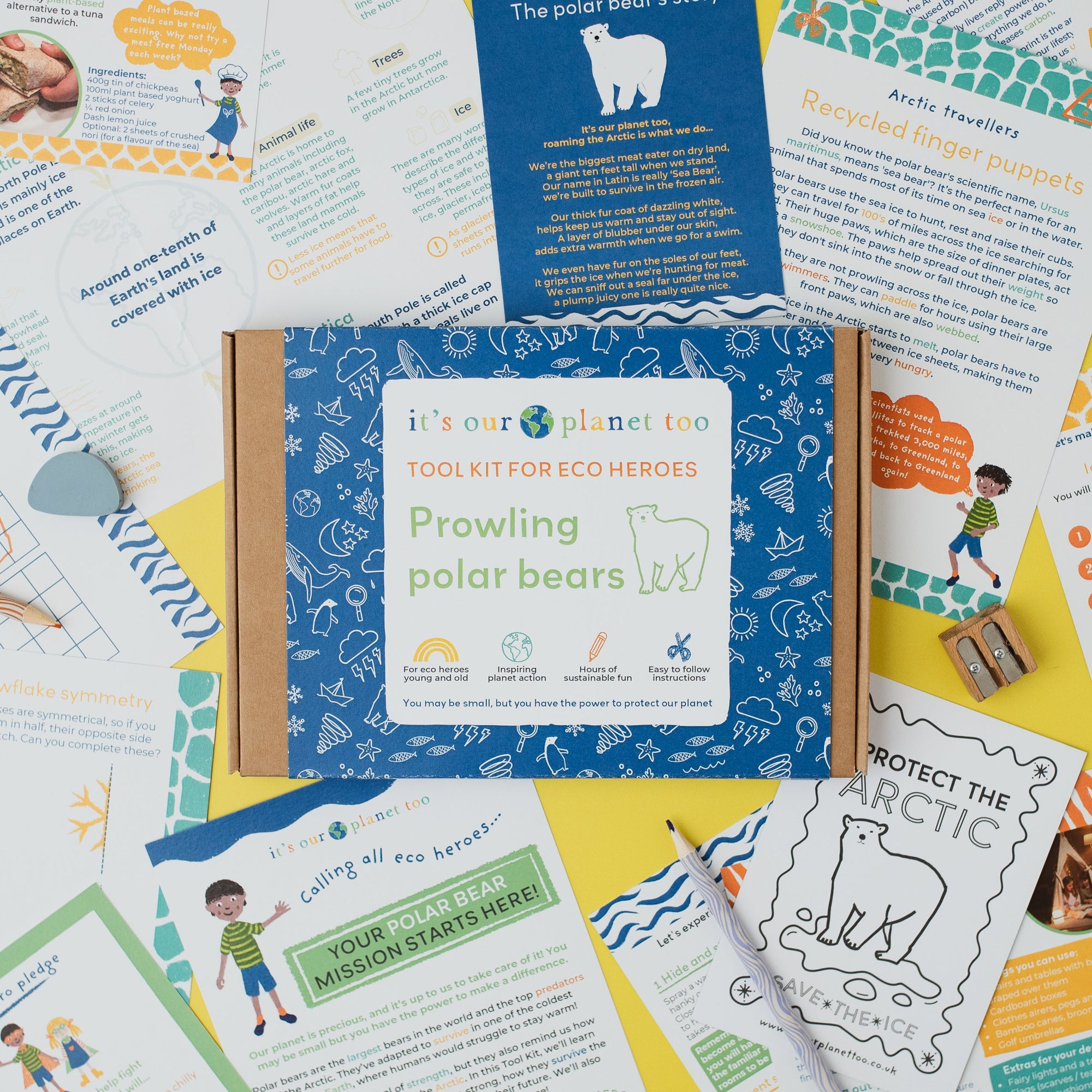 Educational materials on a table with colorful pages and a blue notebook.