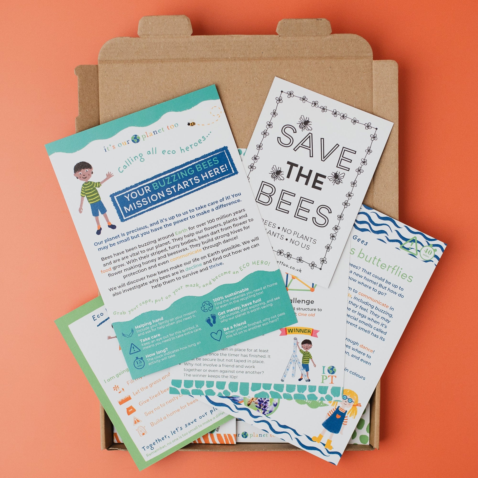 Educational materials on a cardboard box against an orange background