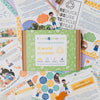 Educational kit for eco-heroes with worksheets and a box labeled 'A World of Waste'.